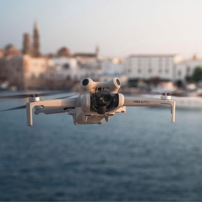 DJI Mini 4 Pro Fly More avec DJI RC 2 + Card Care Refresh 1-Year Plan, Mini Drone Pliable avec Caméra 4K, Moins de 0,549 lb/249 g, Temps de Vol de 34 min, 2 Batteries Supplémentaires, C0
